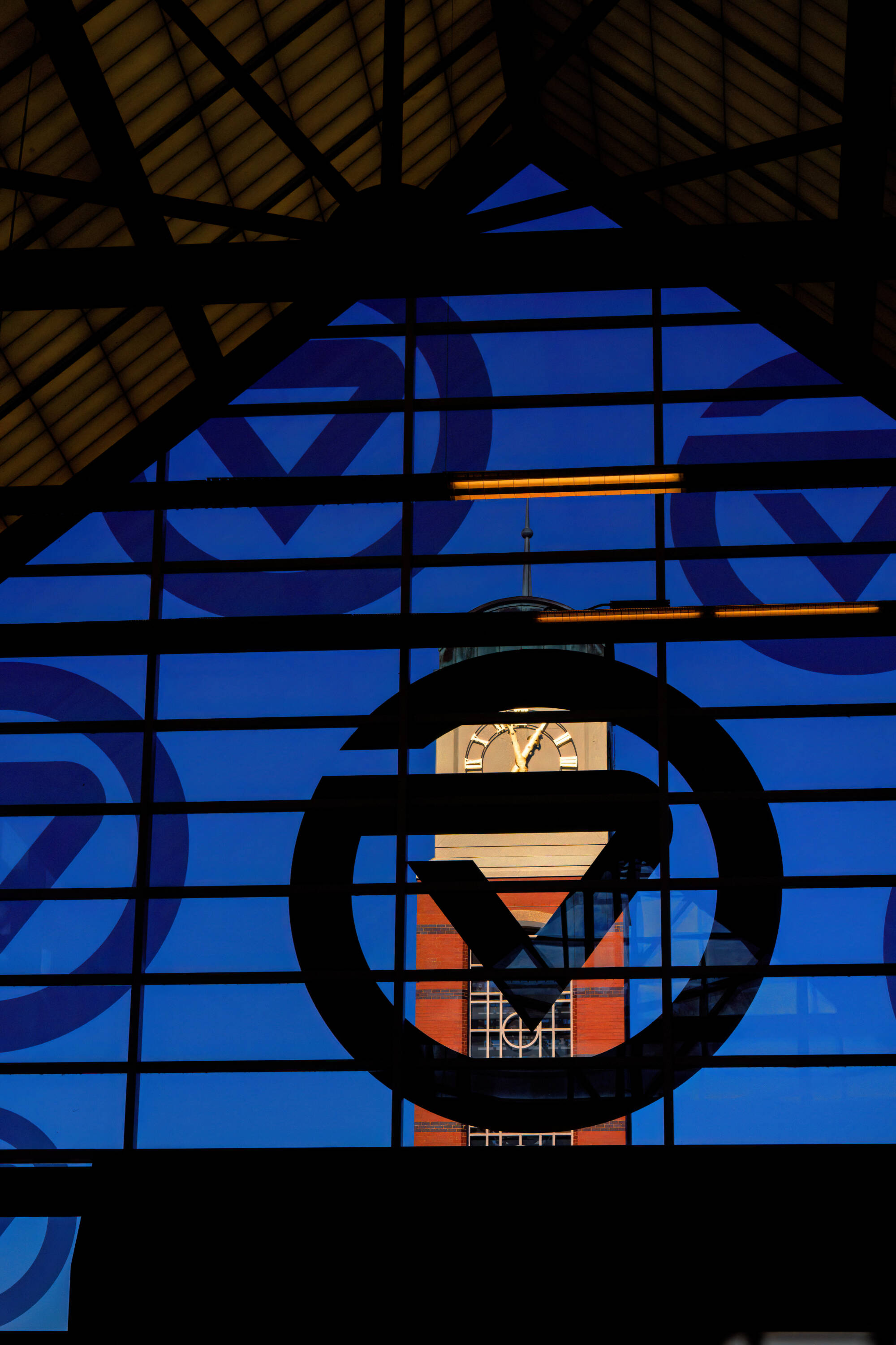 FEATURE_ Cook Carillon Tower seen through glass of Kirkhof Center entryway on Monday,  2025-11-17.  Photography by Steve Jessmore
